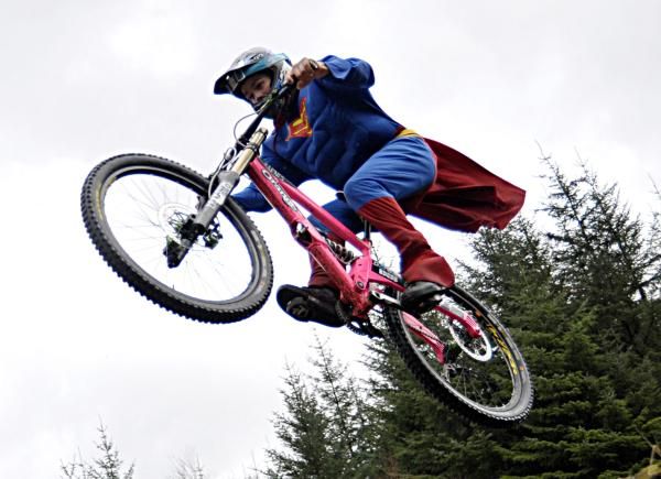 Is it a bird? Is it a plane? No it&rsquo;s a Mountain Bike superhero taking off the Downhill track in Fort William, which is preparing to host its 10th birthday celebrations on the 4th and 5th of June.