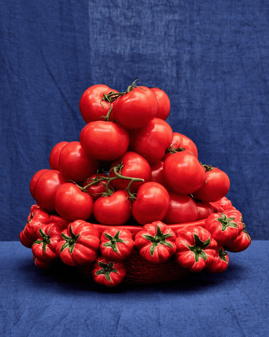 Red Ceramic Tomato Decorative Bowl in a rotating gif.