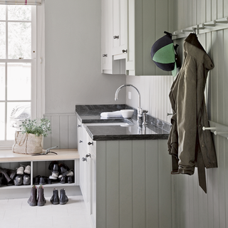 laundry room with wash basin and wooden peg rail