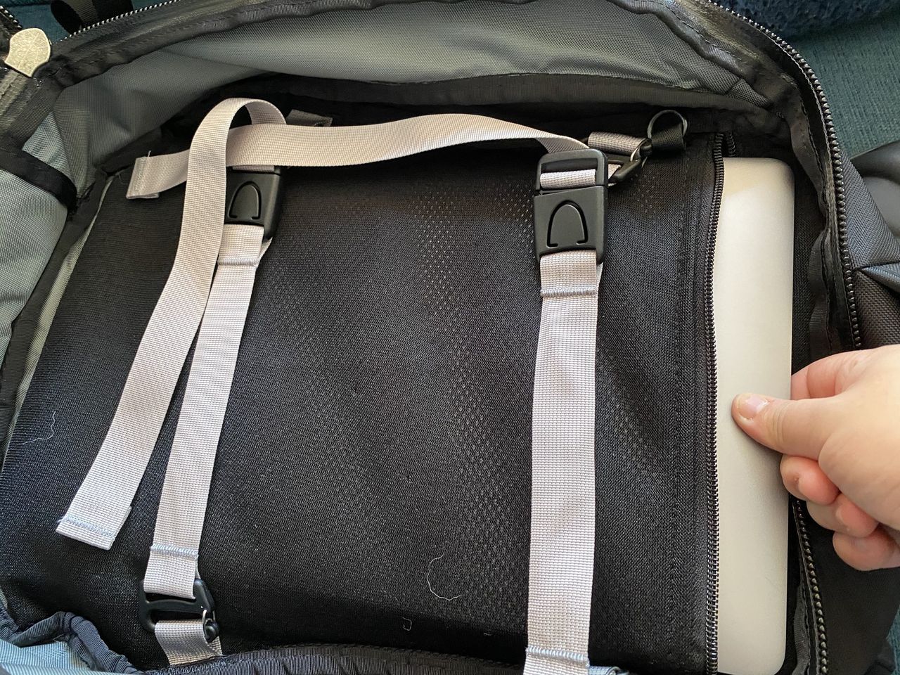 Pulling laptop out from main compartment