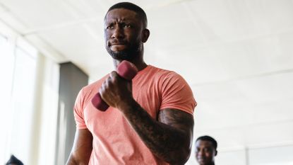 Man performing a dumbbell biceps curl