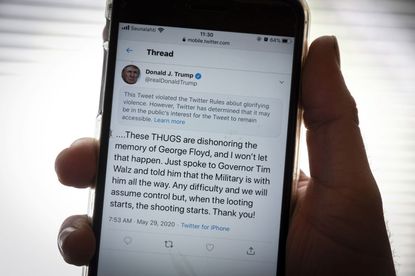 The twitter page of US President Donald Trump's is displayed on a mobile phone in Vaasa, Finland, on May 29, 2020