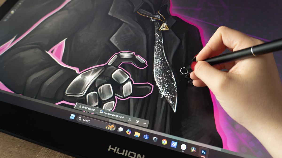 A Huion Kamvas Pro 27 drawing tablet in use on a desk
