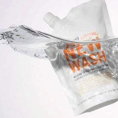 A Hairstory hair wash pouch in water.