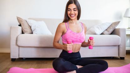 Woman working out with a set of dumbbells