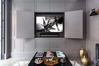 gray panelled tv/media room