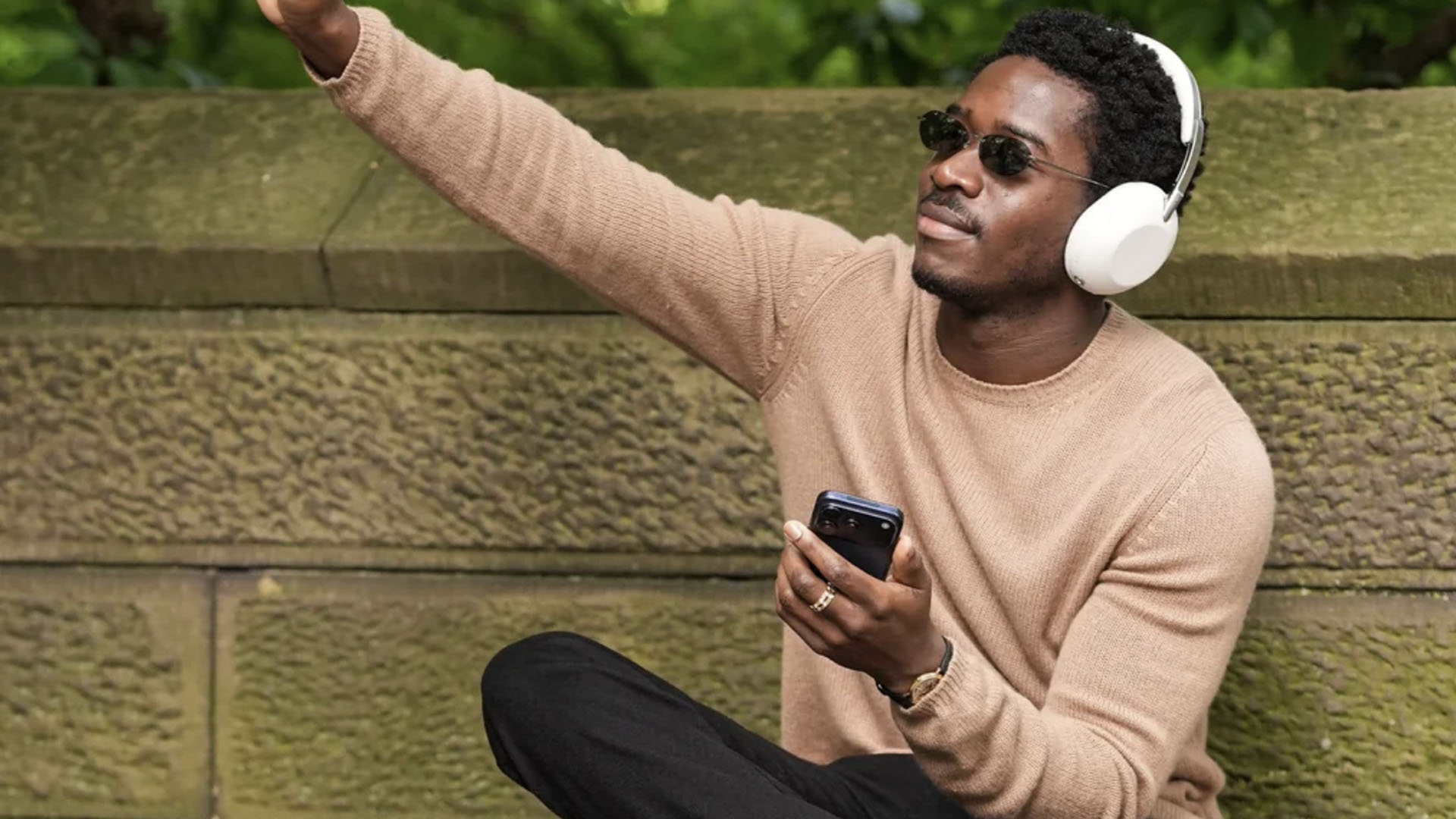 Damson Idris wearing headphones.