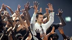 Harry Styles performs with dancers