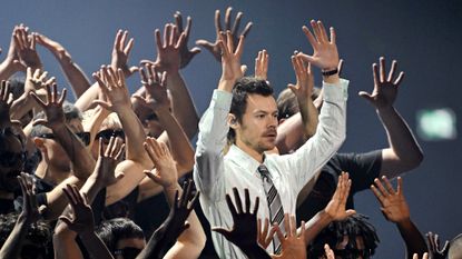 Harry Styles performs with dancers