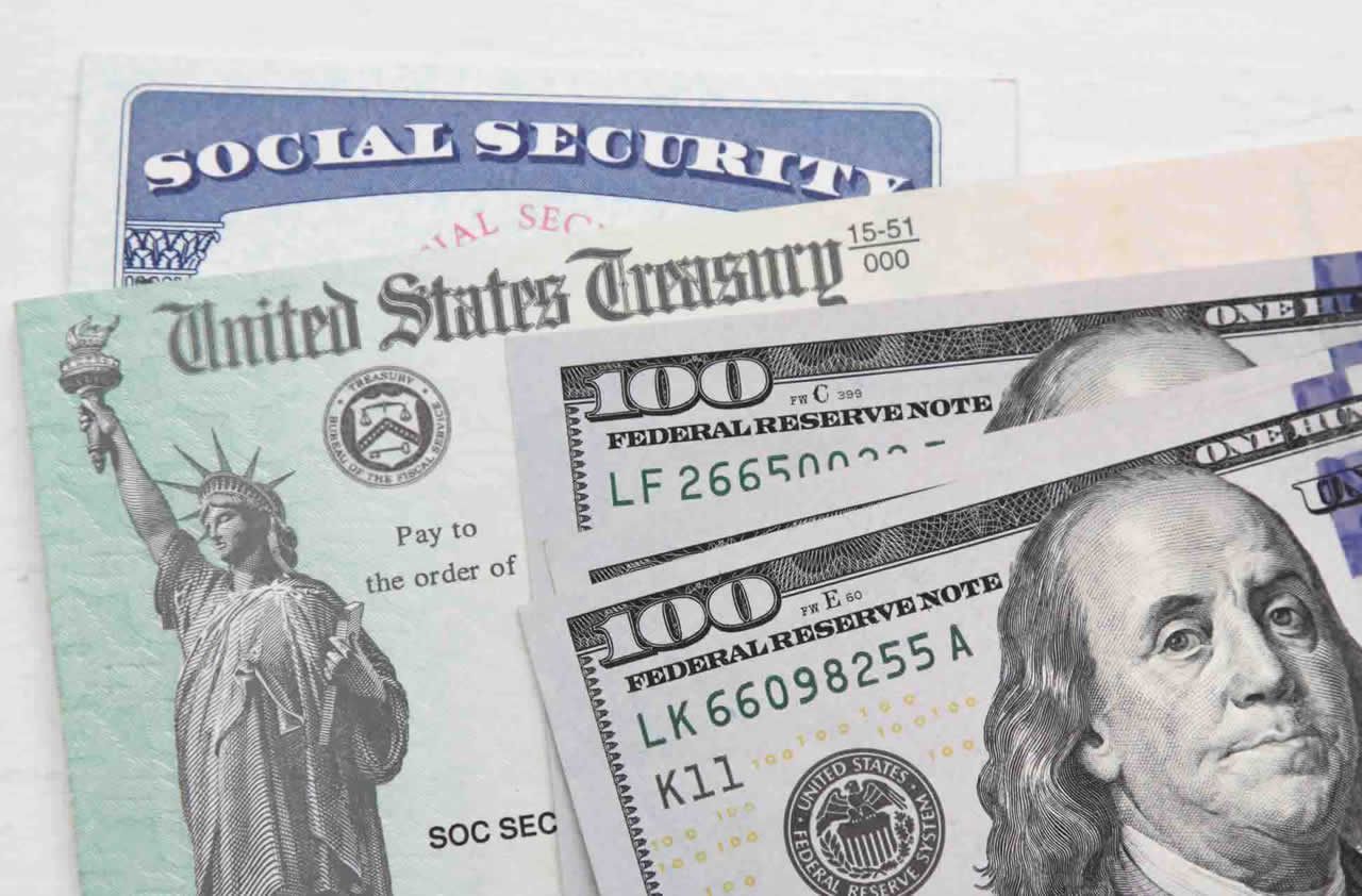 Social Security card and $100 bill