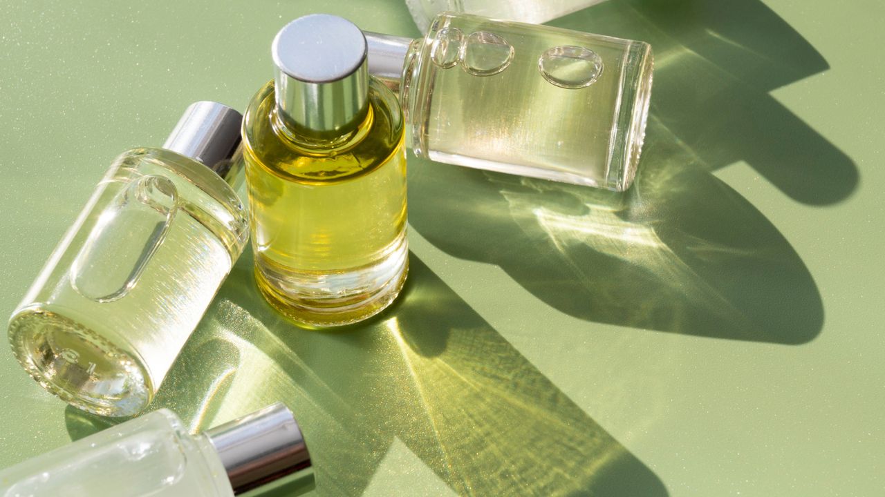 Perfume bottles on a green background