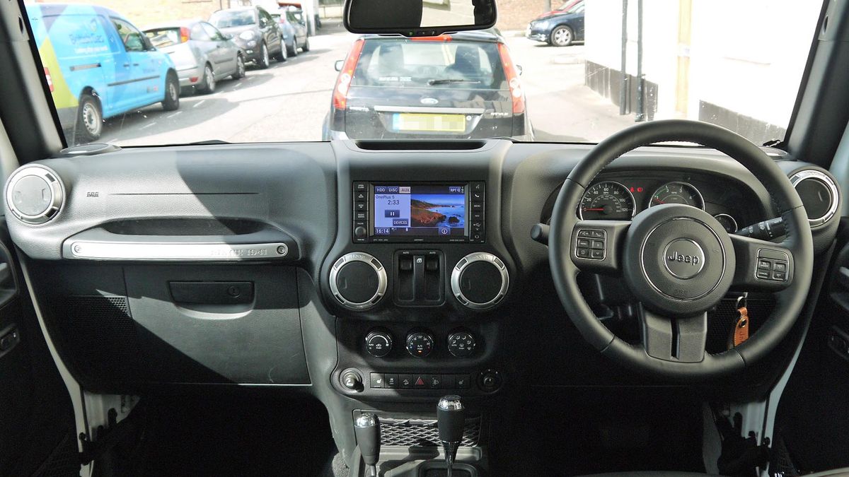 The rugged interior of the Wrangler doesn't sport the usual creature comforts of most cars