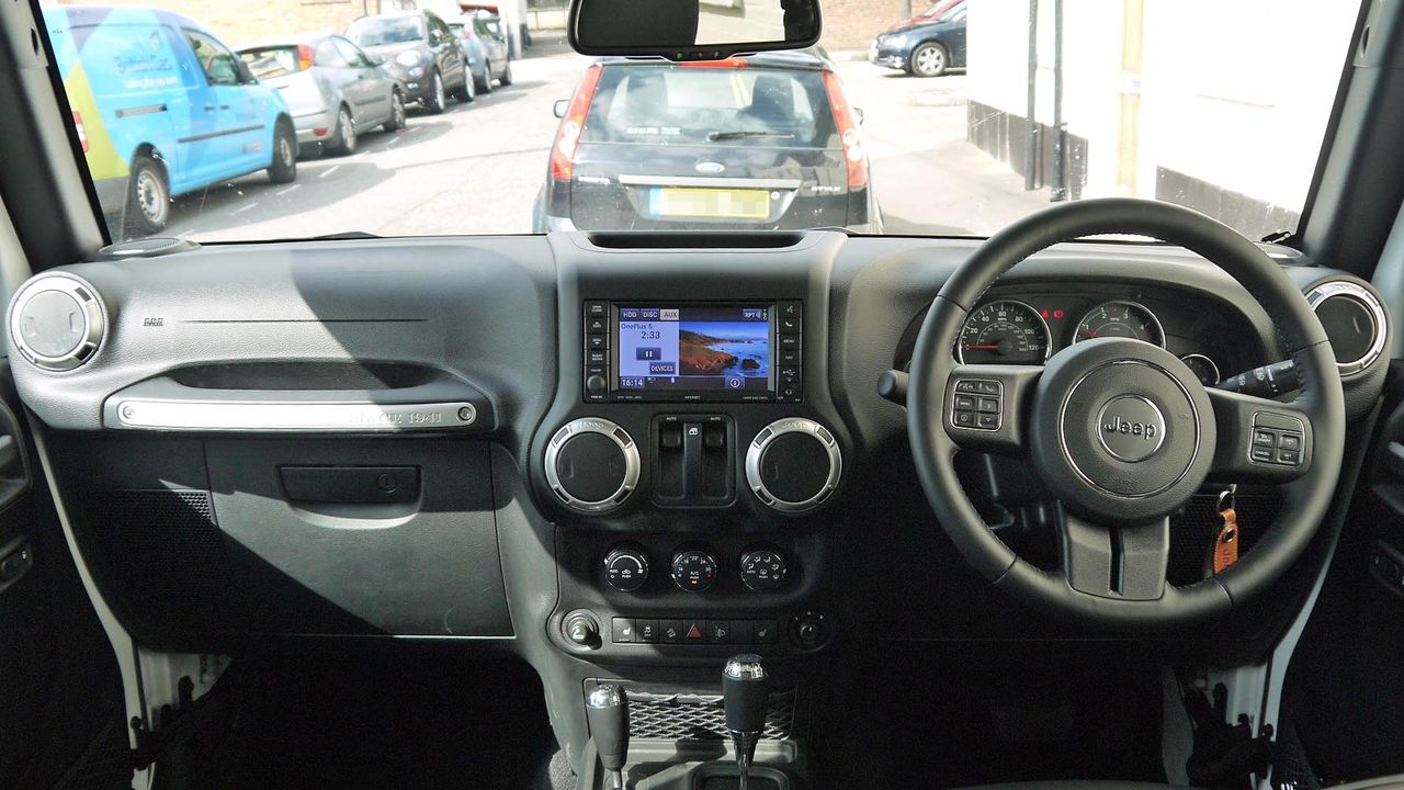The rugged interior of the Wrangler doesn't sport the usual creature comforts of most cars