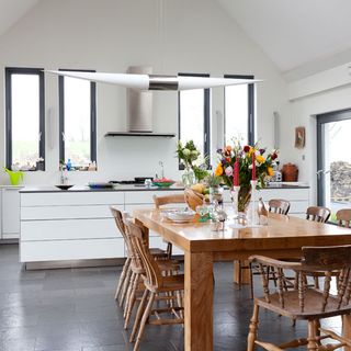 kitchen room with white walls and kitchen chimney