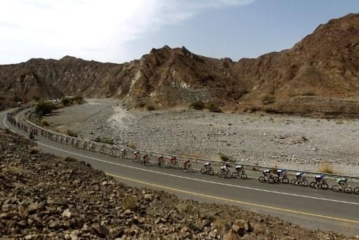 The Tour of Oman peloton races through dramatic scenery