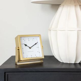 A square gold clock from McGee & Co.