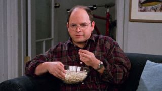 George eating popcorn on Seinfeld