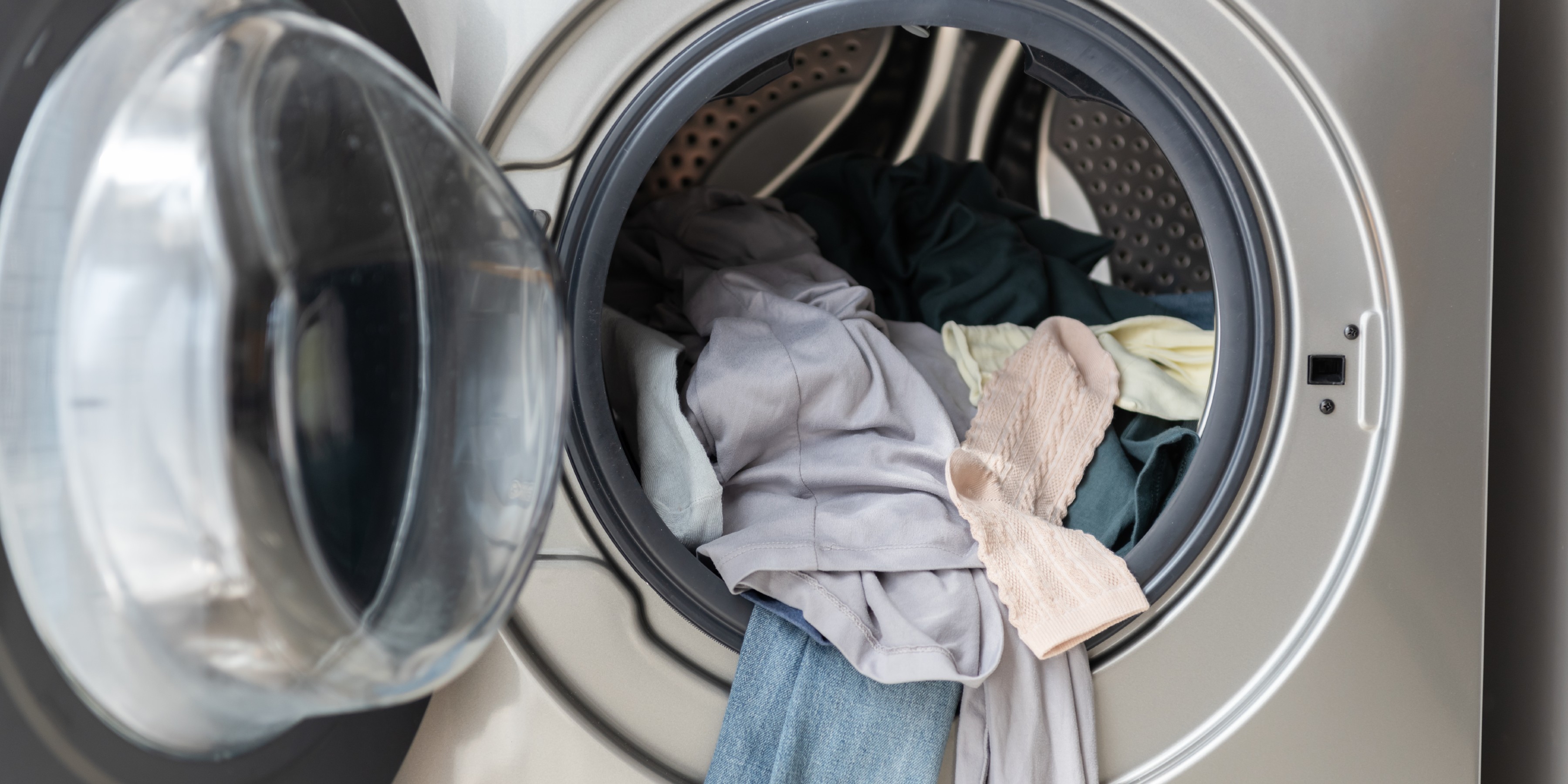 Laundry in a tumble dryer with the door open