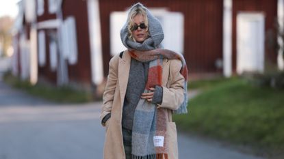 Woman wearing a checkerboard scarf in Copenhagen