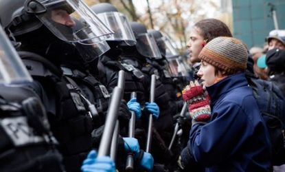 Occupiers face off with police during a Portland, Ore., demonstration: To control the crowds, some cops have used pepper spray, which can cause intense skin and eye pain.