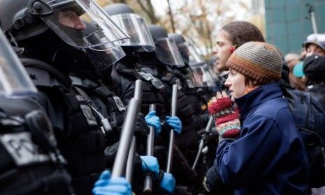 Occupiers face off with police during a Portland, Ore., demonstration: To control the crowds, some cops have used pepper spray, which can cause intense skin and eye pain.