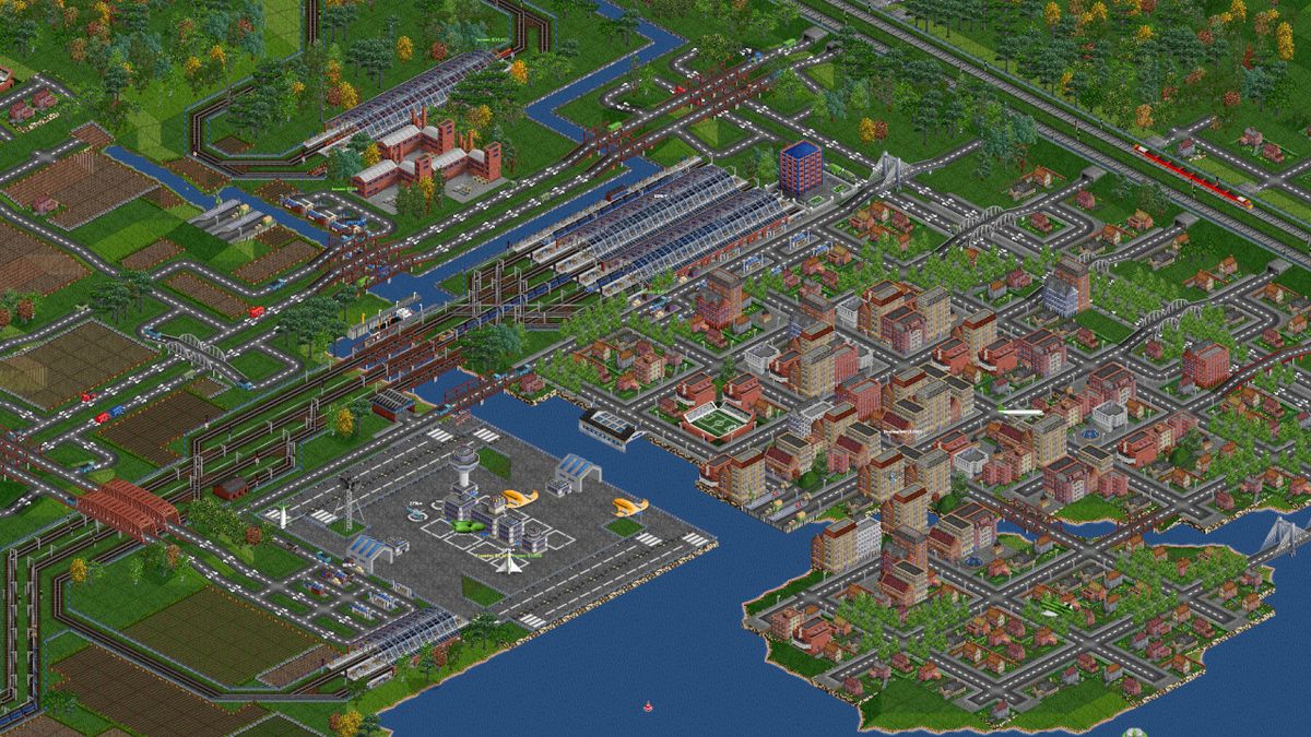 An image from transport game OpenTTD of trains and a village