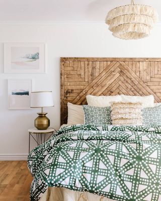 gorgeous patterned wooden headboard brings warmth to a Scandi-style bedroom filled with textured accessories