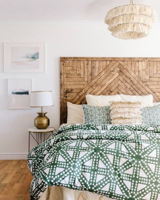 Gorgeous patterned wooden headboard brings warmth to a Scandi-style bedroom filled with textured accessories