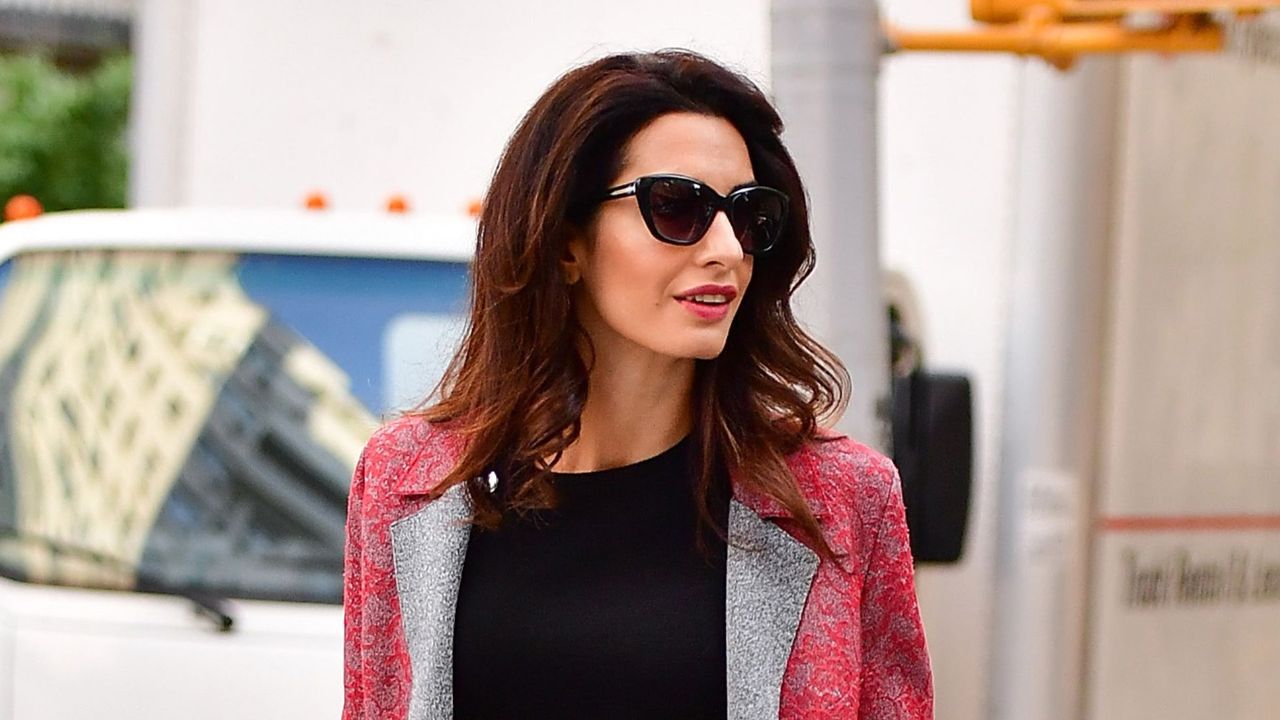 Amal Clooney wearing red coat