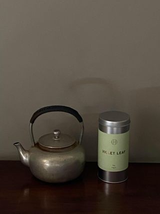 perfumer h jasmine tea on silver plate with silver tea pot