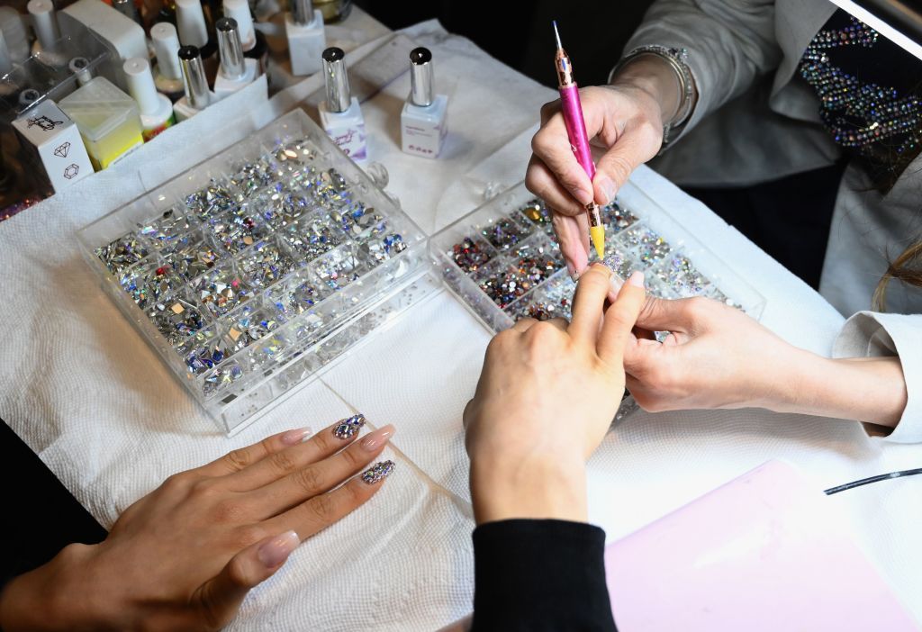 A woman gets her nails done.