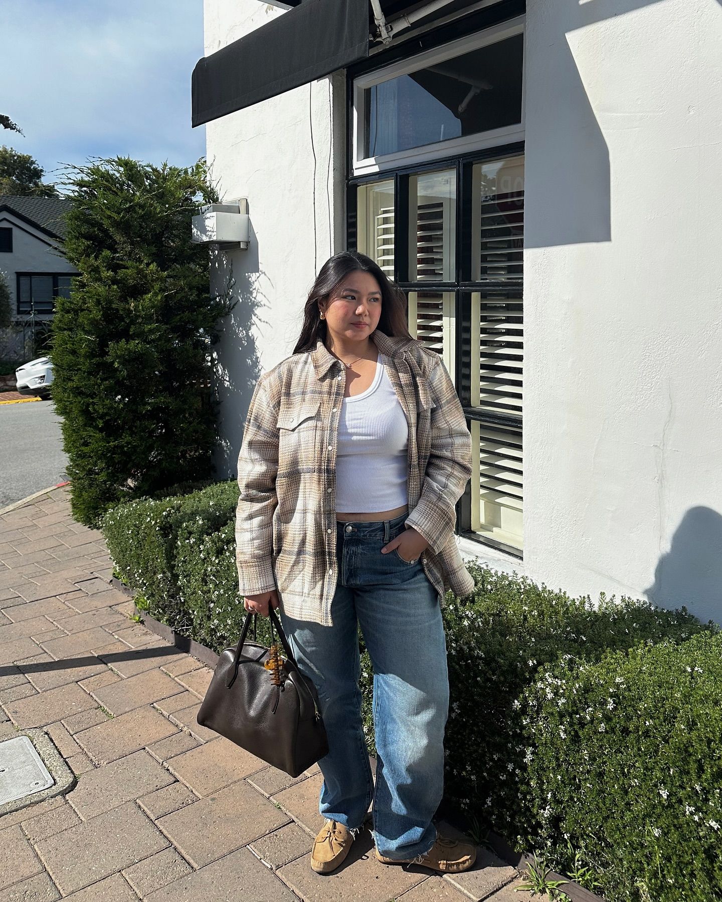 Influencer wears moccasin shoes.