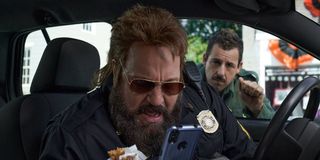 Kevin James as Officer Steve Downing and Adam Sandler as Hubie DuBois in Hubie Halloween (2020)