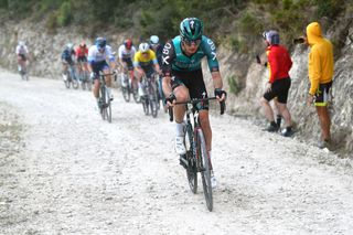 ALTO DE LAS ANTENAS DEL MAIGMO TIBI ALICANTE SPAIN FEBRUARY 04 Aleksander Vlasov of Russia and Teamm Bora Hansgrohe attacks in the final gravel strokes sector while fans cheer during the 73rd Volta A La Comunitat Valenciana 2022 Stage 3 a 1551km stage from Alicante to Alto De Las Antenas Del Maigmo Tibi 1080m VCV2022 on February 04 2022 in Alicante Spain Photo by Dario BelingheriGetty Images