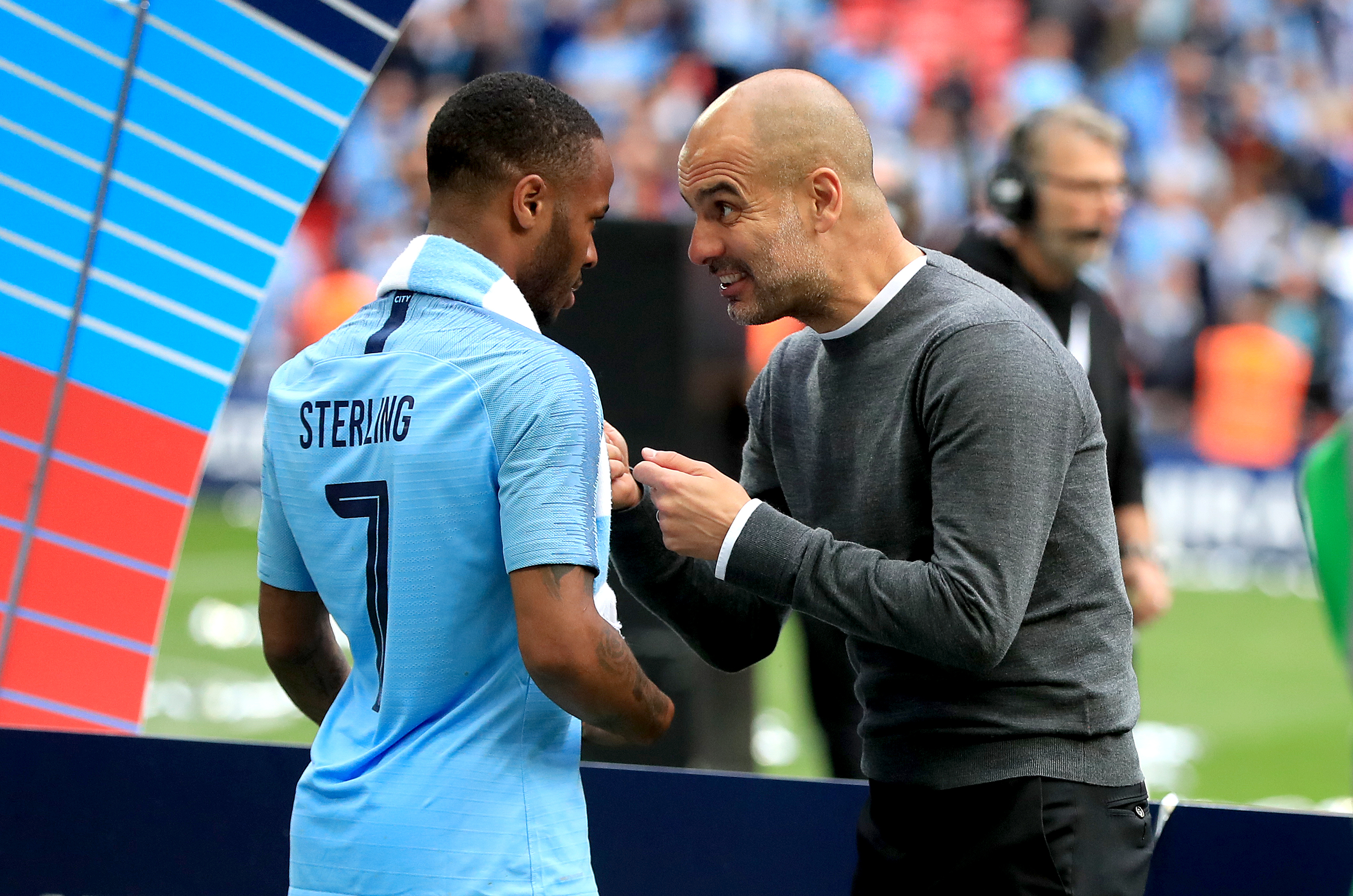 Pep Guardiola, right, has a word with Raheem Sterling