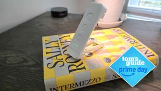 Glocusent USB Rechargeable Book Light on top of a book with a Prime Day deal badge signifying a sale price