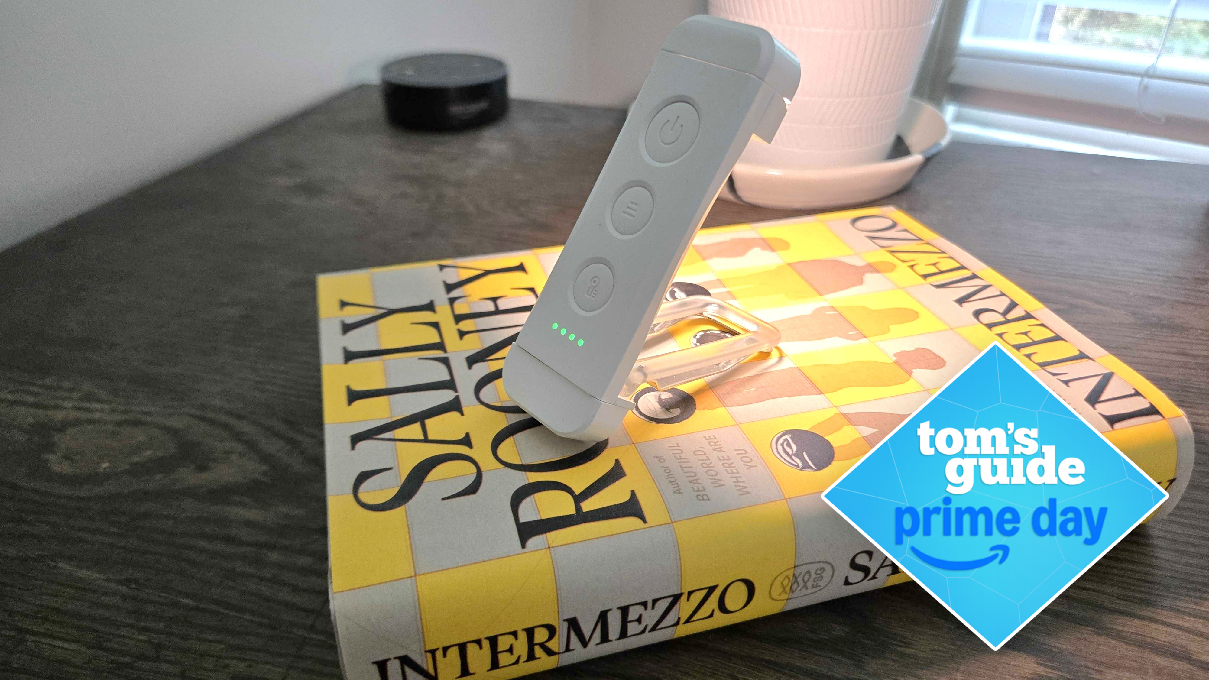 Glocusent USB Rechargeable Book Light on top of a book with a Prime Day deal badge signifying a sale price