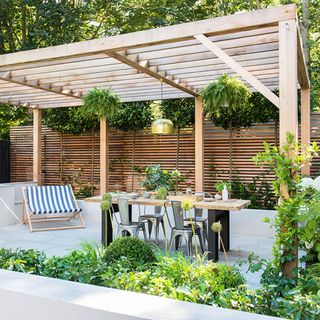 outside area with timber pergola and table and chair