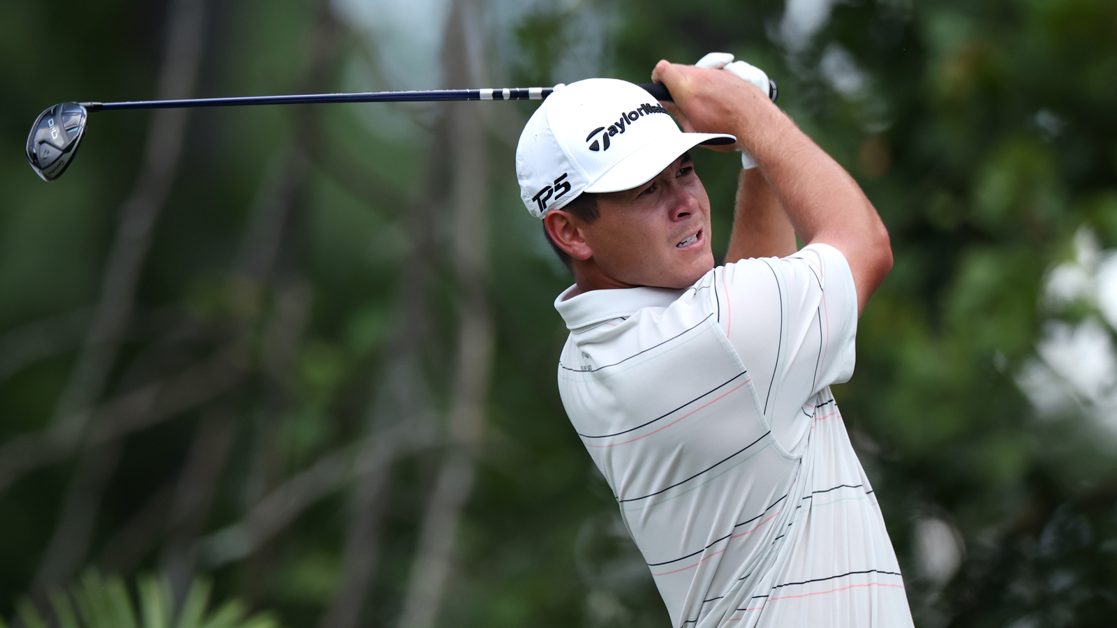 Karl Vilips hits a fairway wood