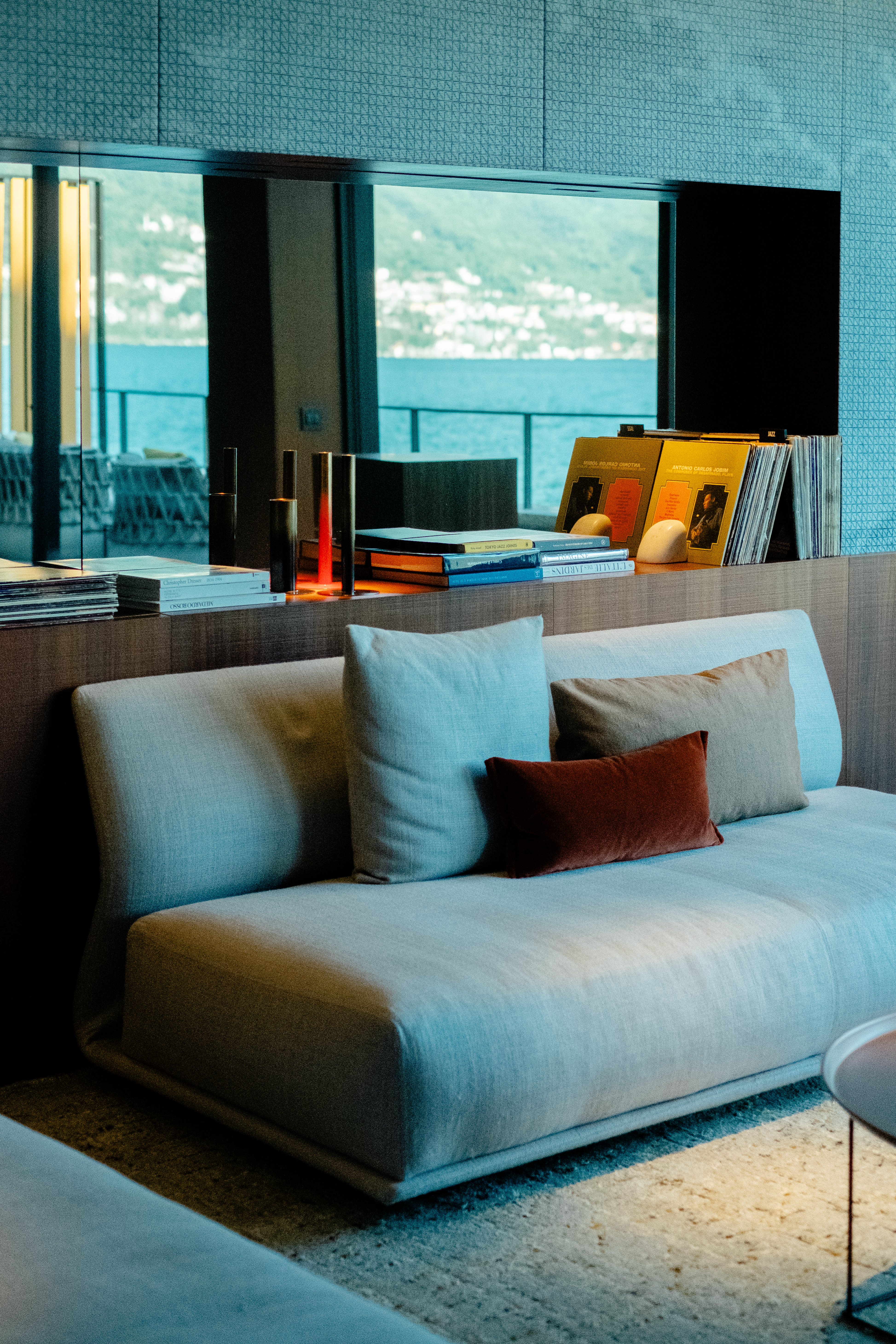 A mid-century modern-inspired hotel suite features earthy-tinted interiors, colorful design collectibles, and plenty of music equipment.
