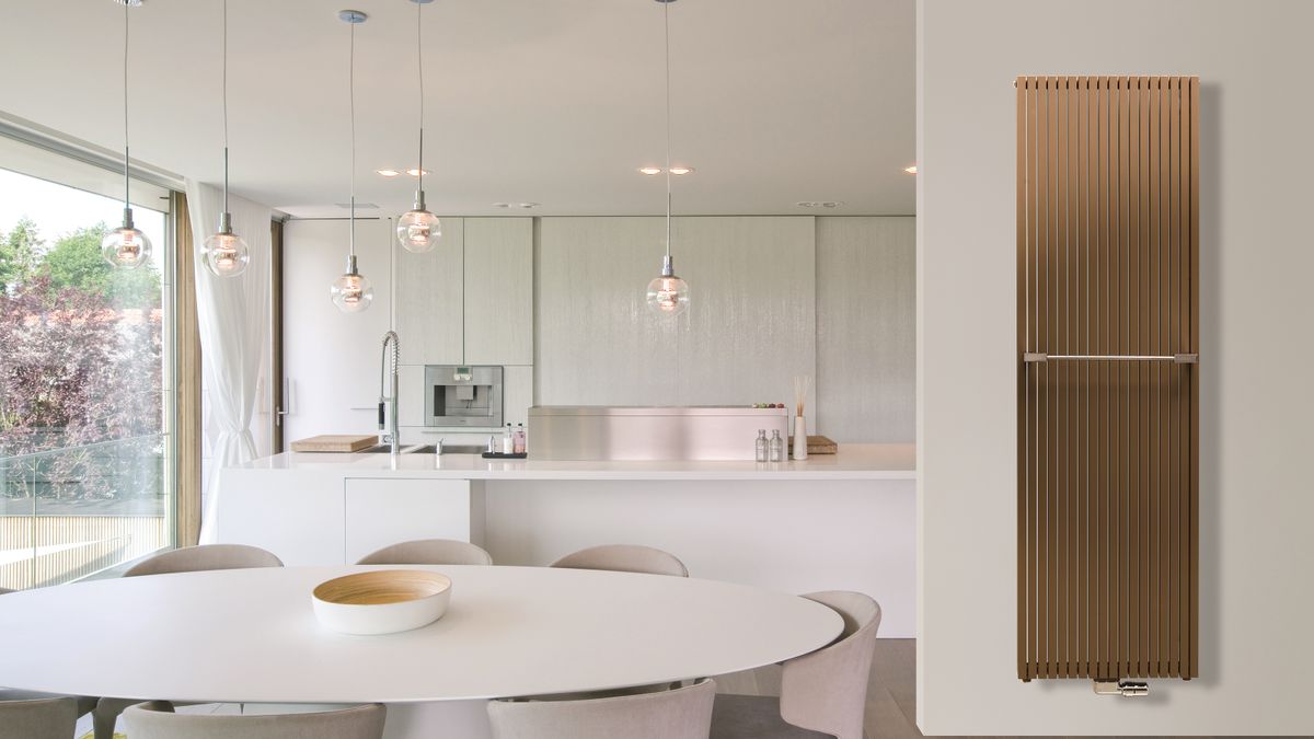 pink and white kitchen with bronze vertical radiator