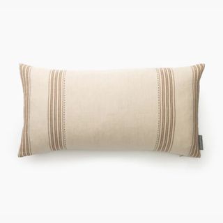 beige long pillow with stripe detailing