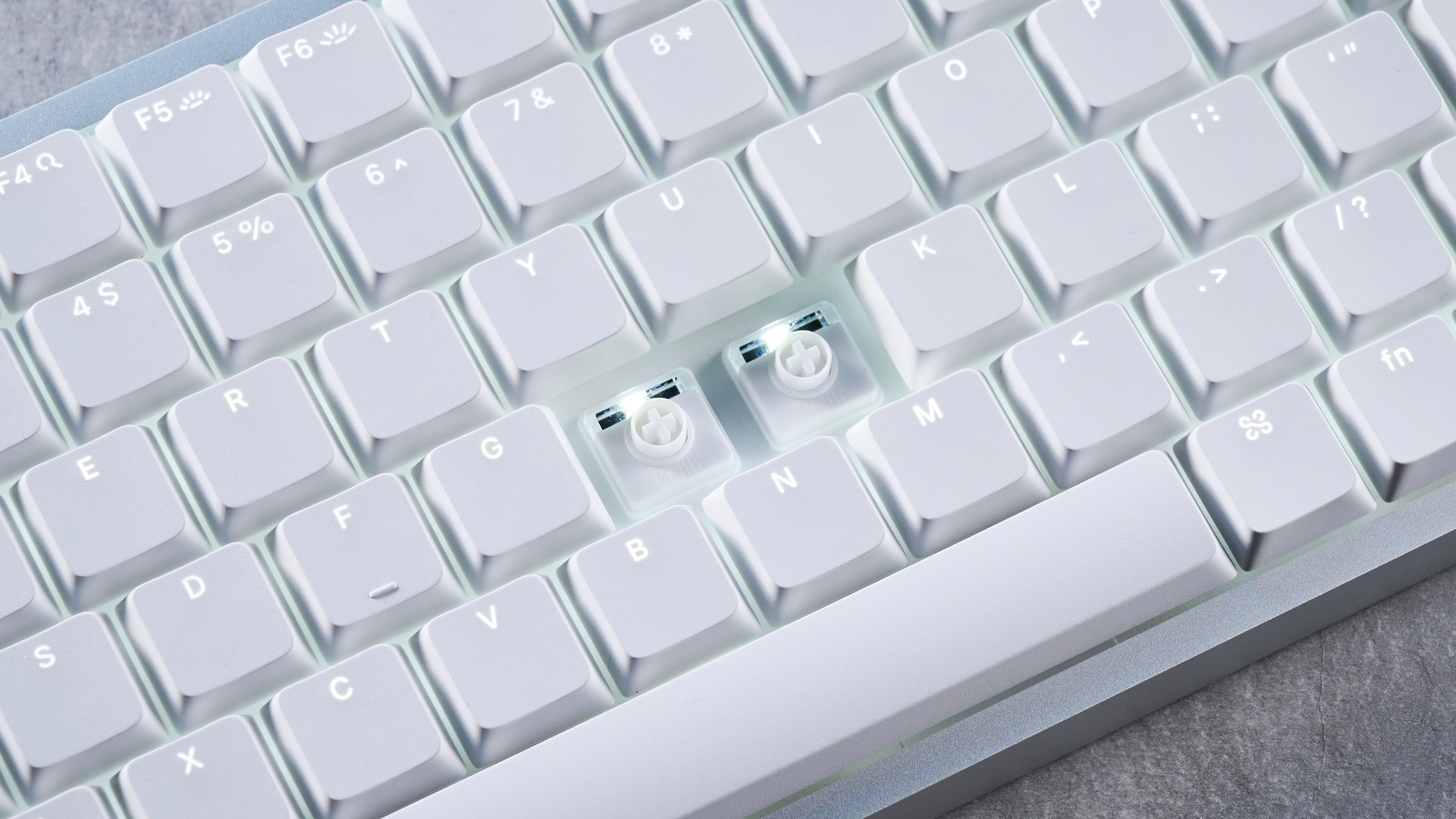 The Lofree Flow 2 on a stone surface with a blue background