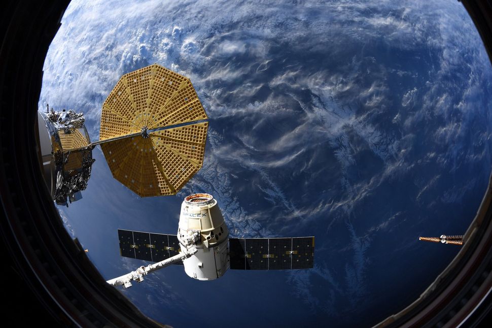 SpaceX Dragon cargo ship, the last of its kind, returns to Earth from space station