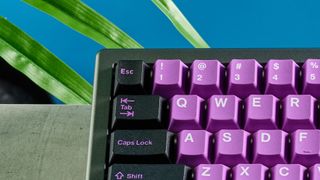 A black and purple Epomaker EK68 wireless mechanical keyboard