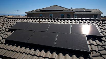 Solar panels seen on the roof of a model home in Clovis, California