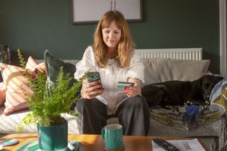 Woman with Zopa card and app