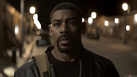 John Stewart (Aaron Pierre) makes his way to the cafe in Rushville, Nebraska to deliver the money he owes Maggie on Lanterns.