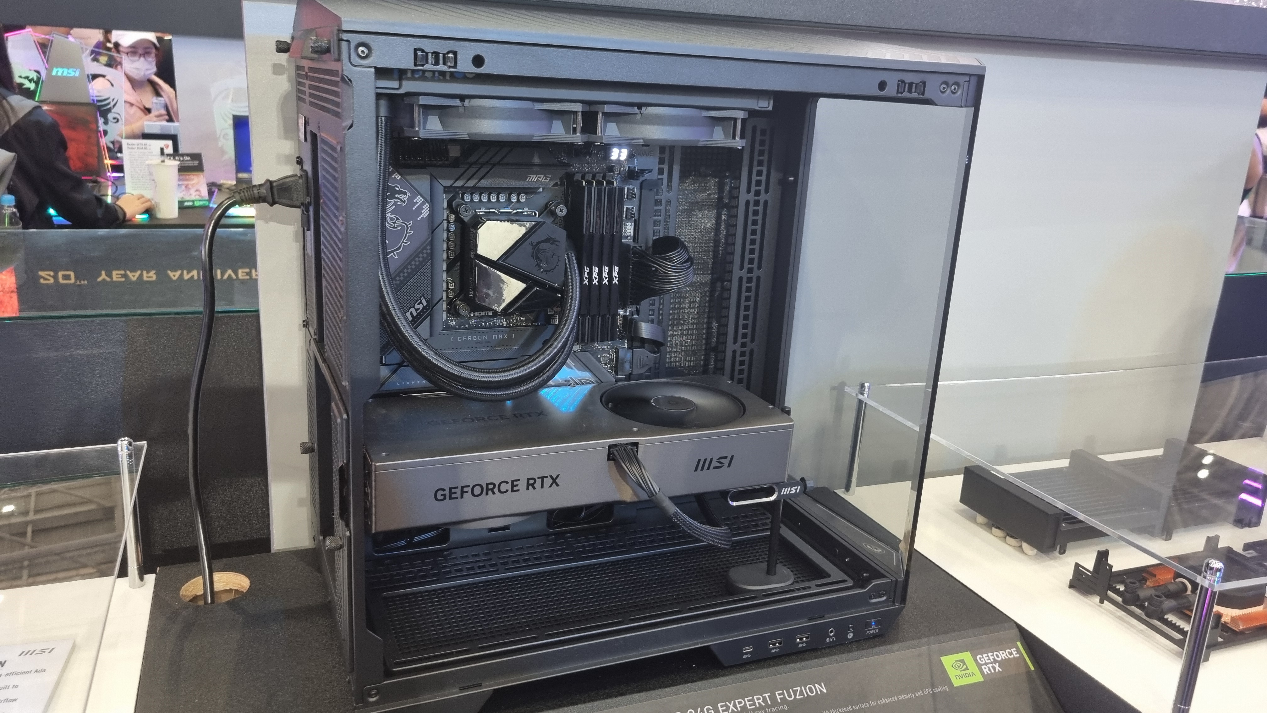 Water-cooled RTX 4080 Super in a rig, no RGB, MSI computex 2024