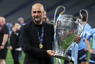 Manchester City manager Pep Guardiola holds the Champions League trophy after his side's victory over Inter Milan in the 2023 final at the Ataturk Olympic Stadium in Istanbul, Turkey